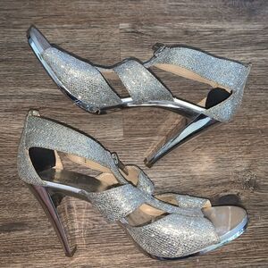 Michael kors silver heels pre-owned condition size 8.5.